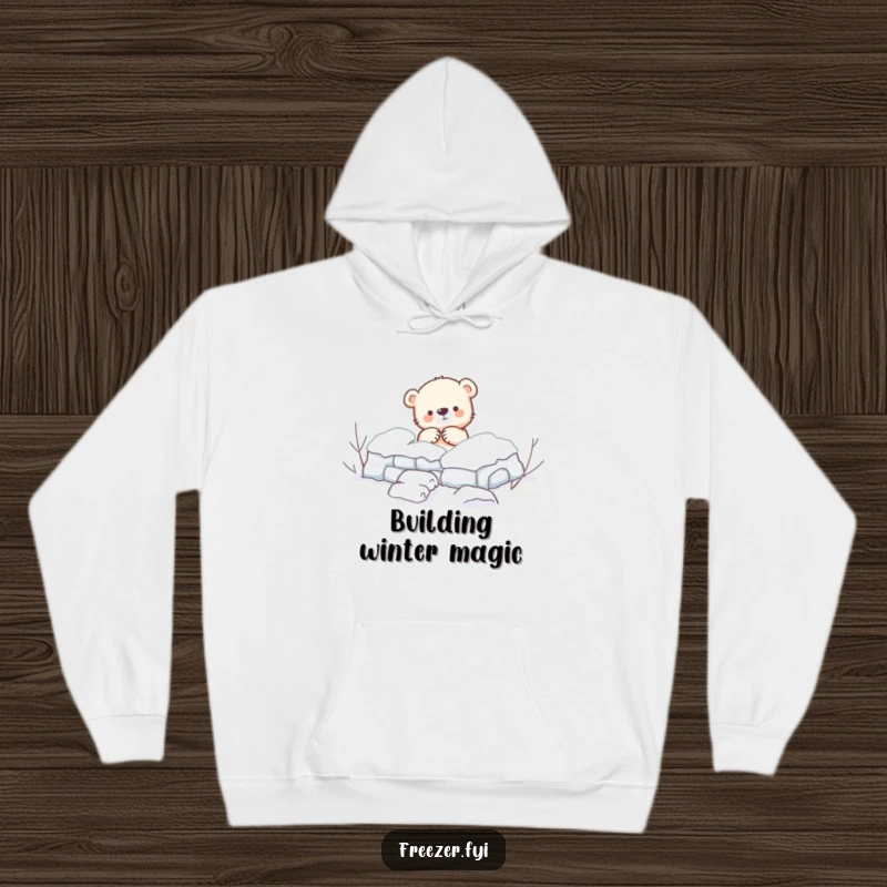 Funny Hoodie: A comfortable hoodie featuring a small bear cub enthusiastically building a snow fort, radiating warmth and winter cheer.