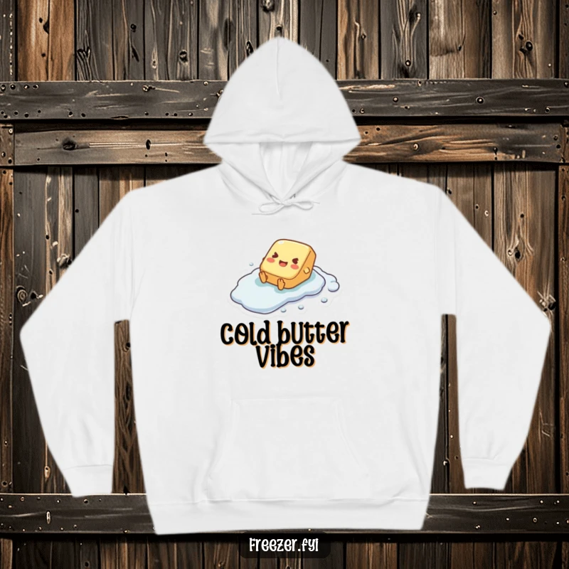 Funny hoodie with a tiny butter pat character joyfully sliding down a frosted, icy surface, radiating happiness.